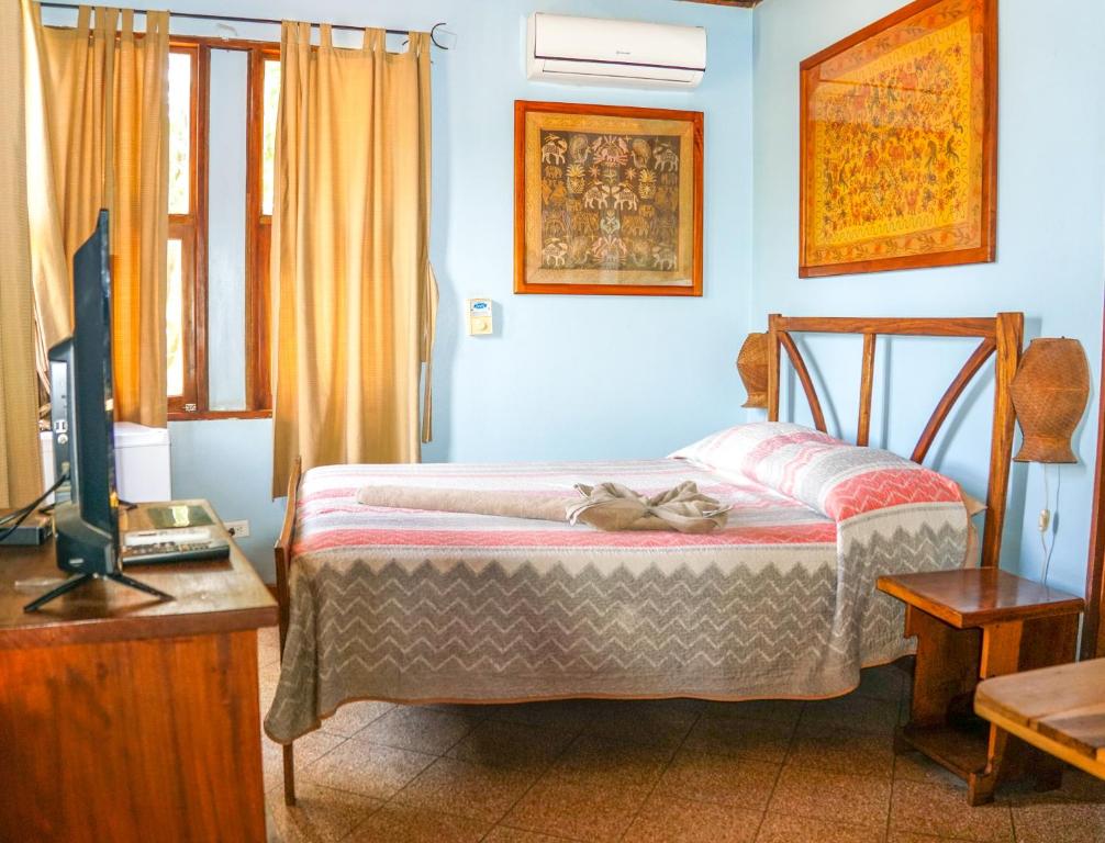 Postel nebo postele na pokoji v ubytování Hotel Boruca Tamarindo