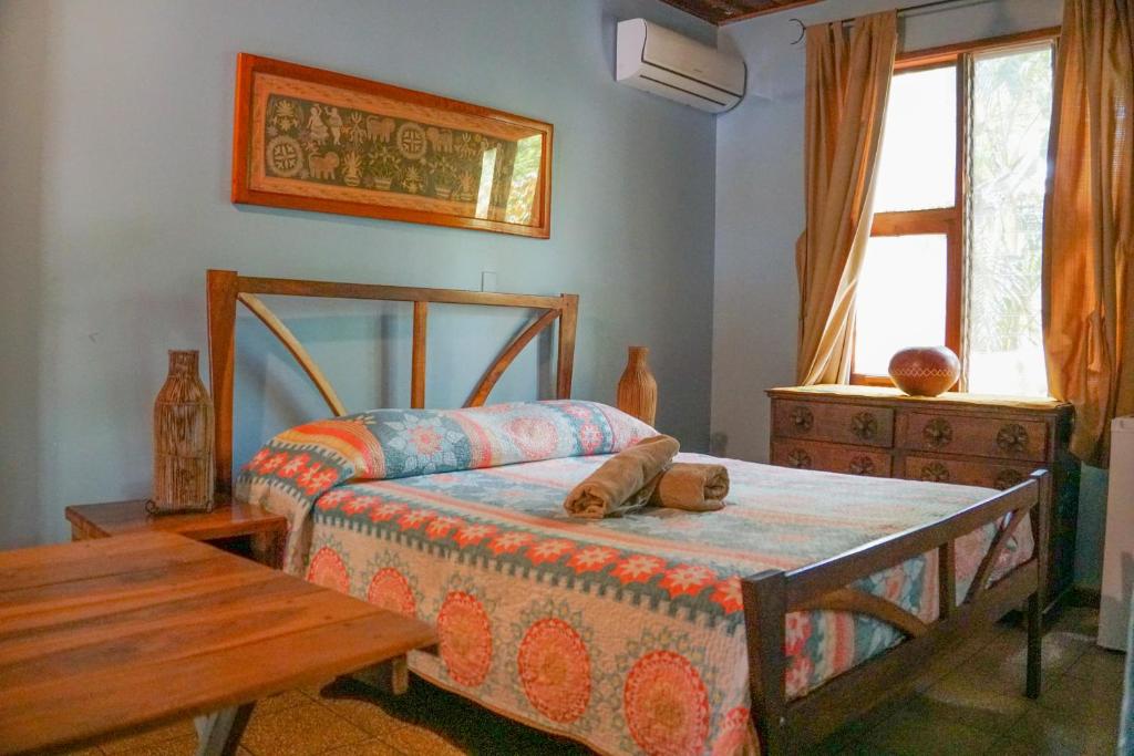Postel nebo postele na pokoji v ubytování Hotel Boruca Tamarindo
