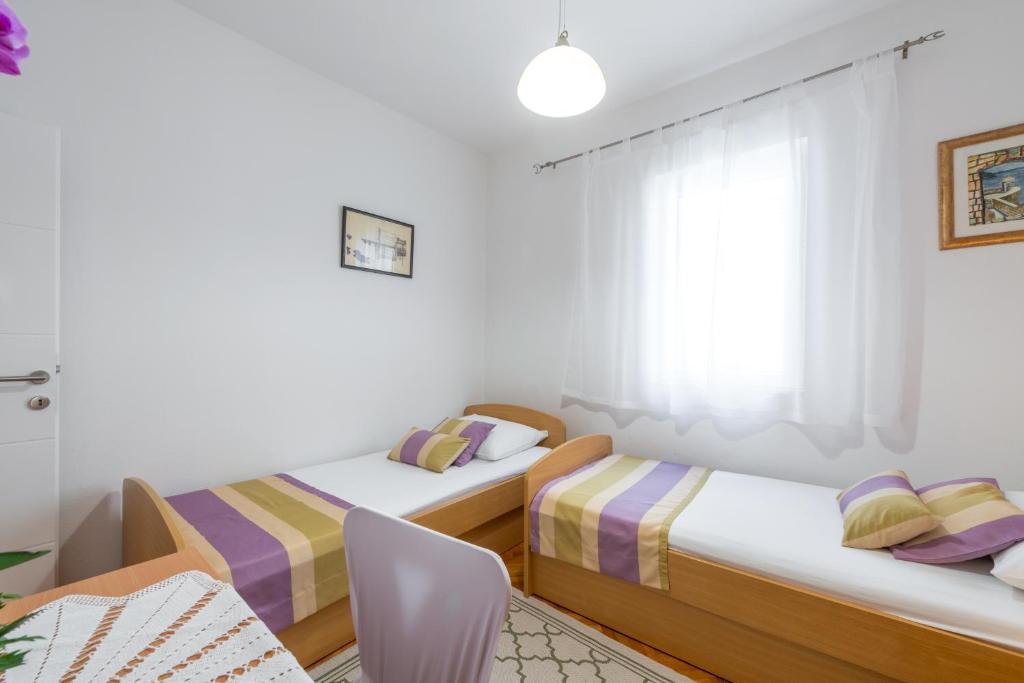 Postel nebo postele na pokoji v ubytování Lovely Apartment