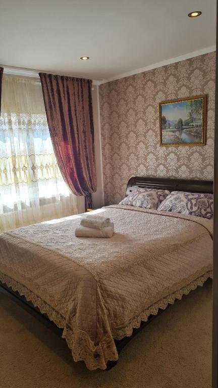 Postel nebo postele na pokoji v ubytování Imperija 85