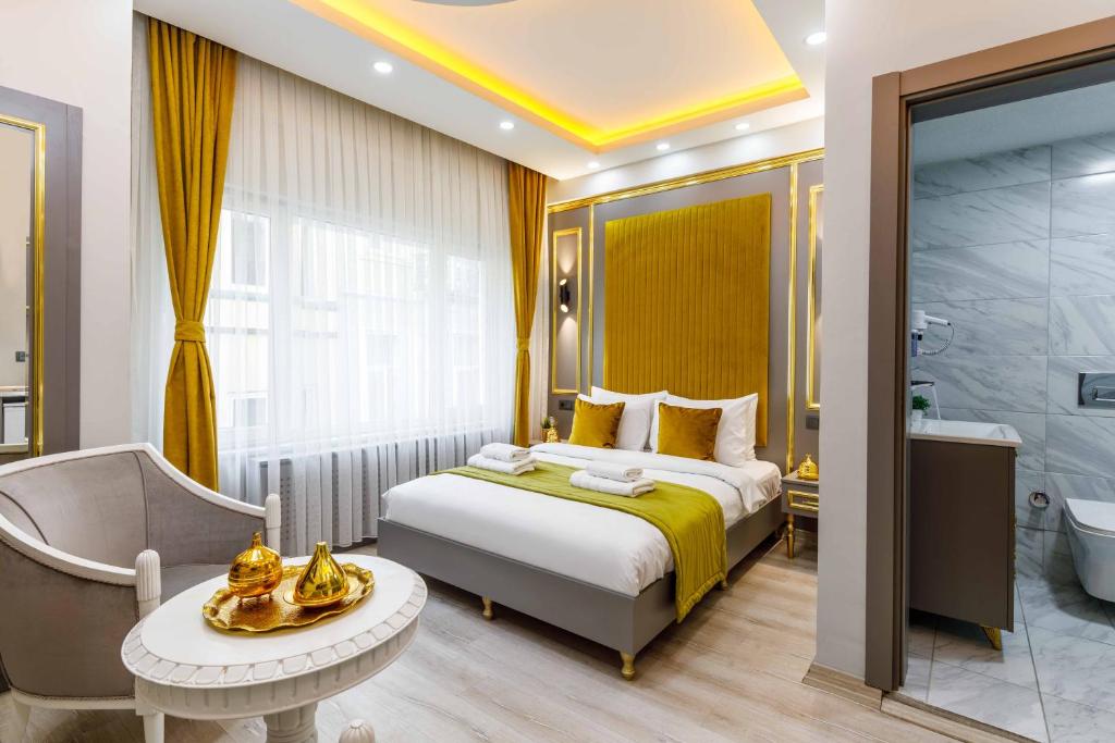 a hotel room with a bed and a bathroom at Santa Rio Taxim in Istanbul