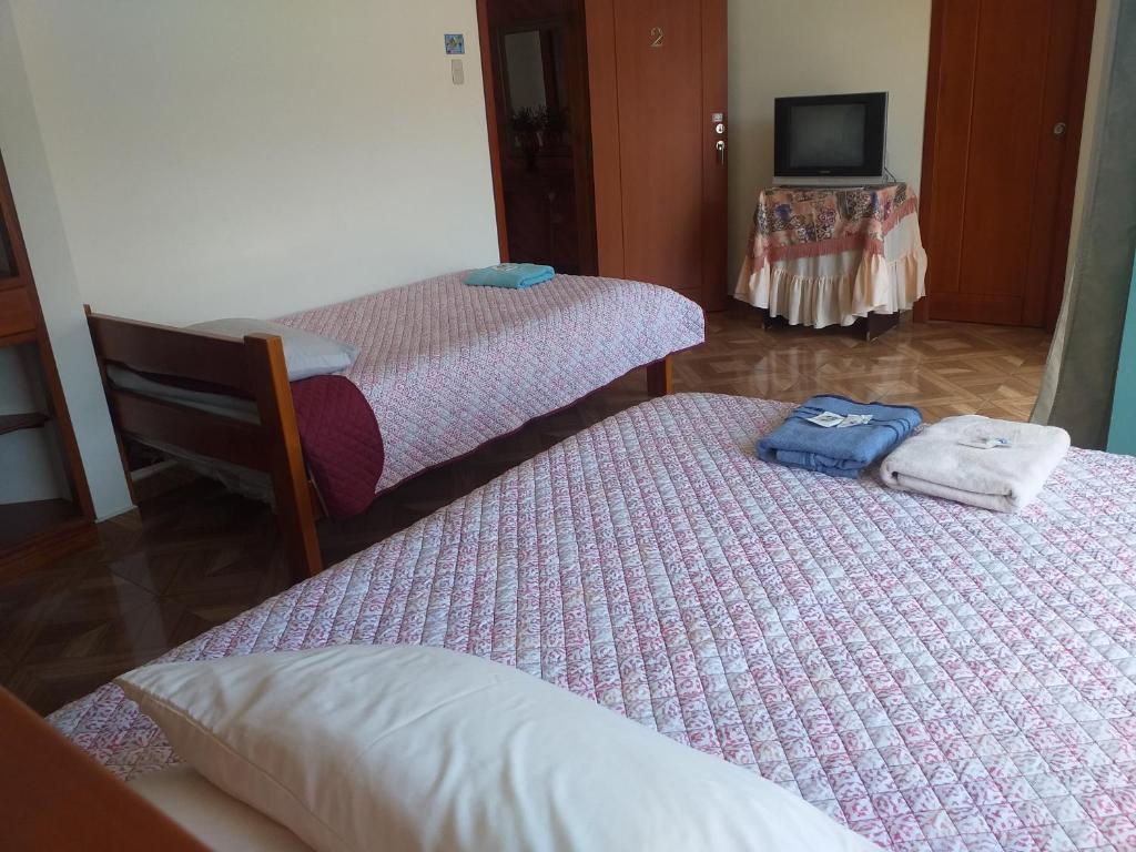 Postel nebo postele na pokoji v ubytování Hostal Resto - Bar "EL PEÑÓN"