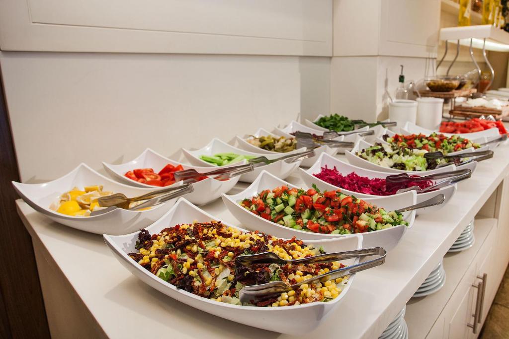 a buffet line with many different types of food at Nidya Hotel Galataport in Istanbul