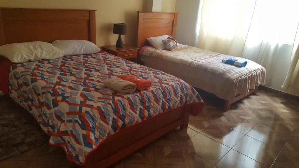 Postel nebo postele na pokoji v ubytování Hostal Resto - Bar "EL PEÑÓN"