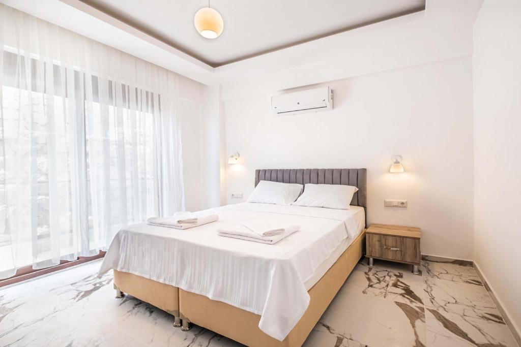 Кровать или кровати в номере Golden Rose Suit pension