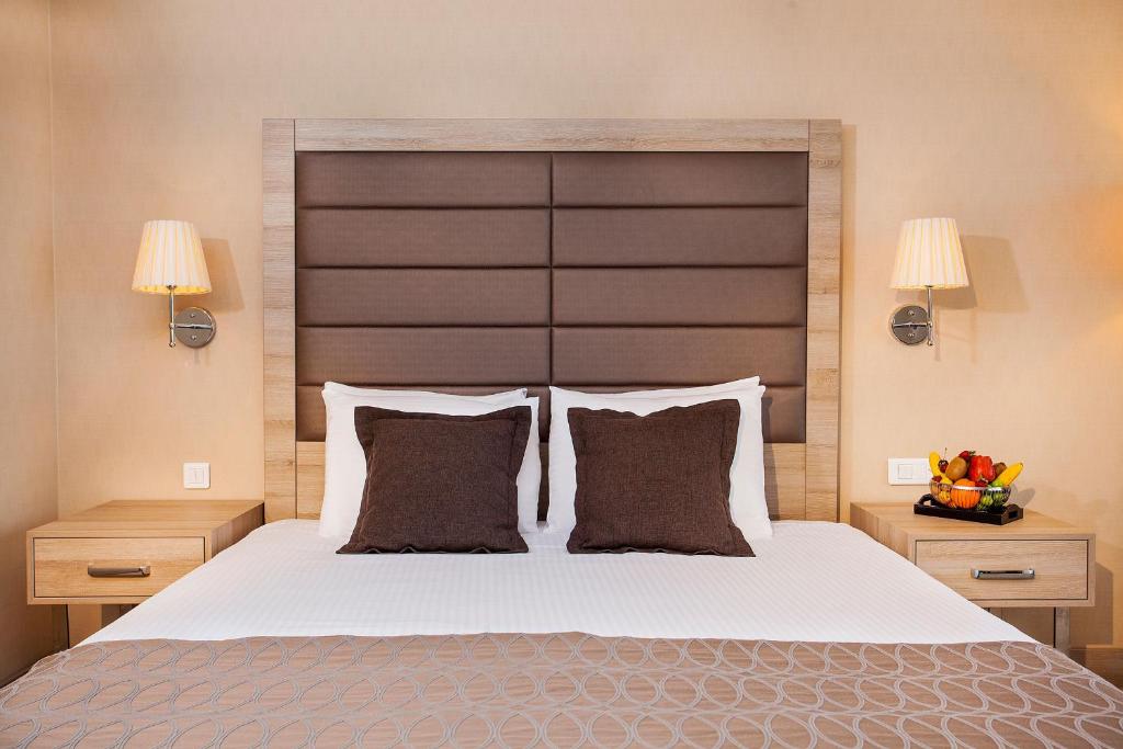 a bedroom with a large bed with two night stands at Nidya Hotel Galataport in Istanbul