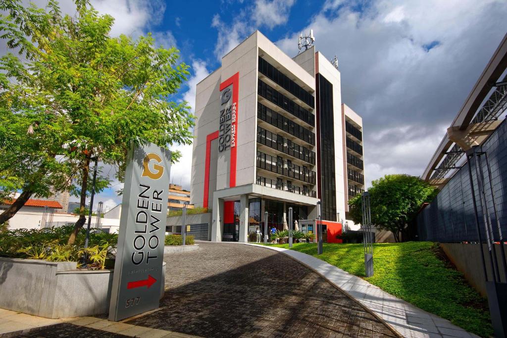 a building with a sign in front of it at Golden Tower Express Berrini by Fênix Hotéis in Sao Paulo