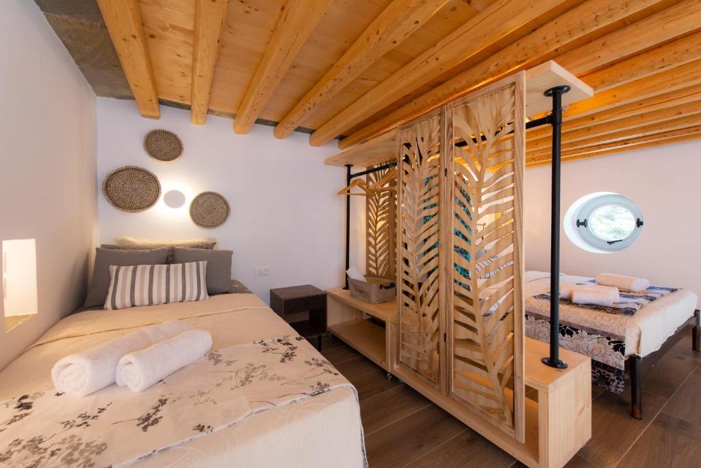 Posteľ alebo postele v izbe v ubytovaní Sunset Coast House - STONE
