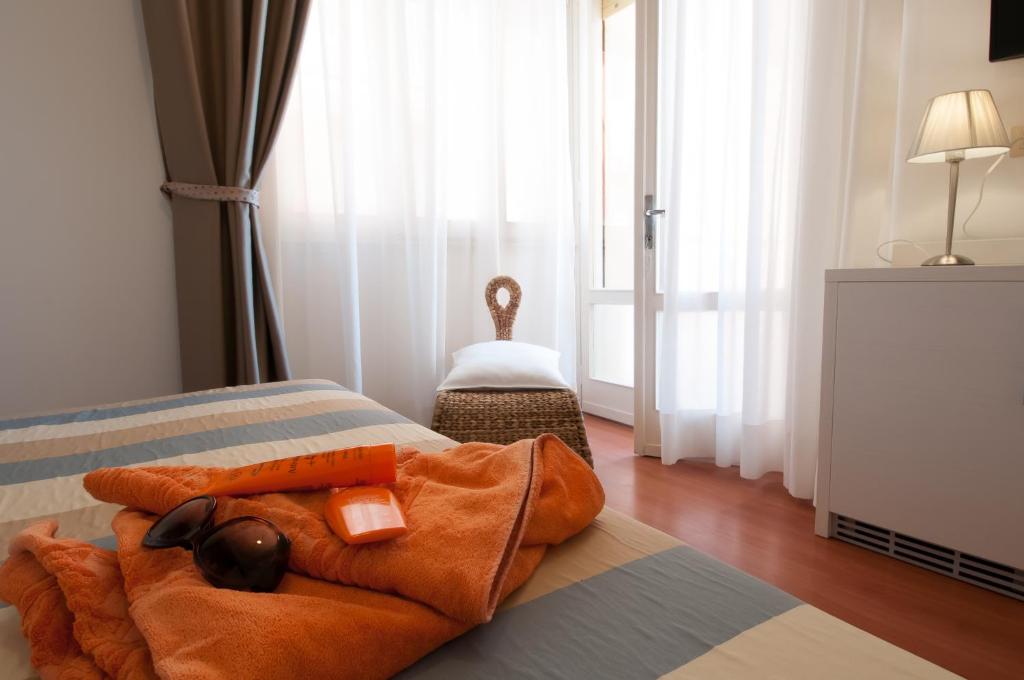 Postel nebo postele na pokoji v ubytování Hotel Telenia
