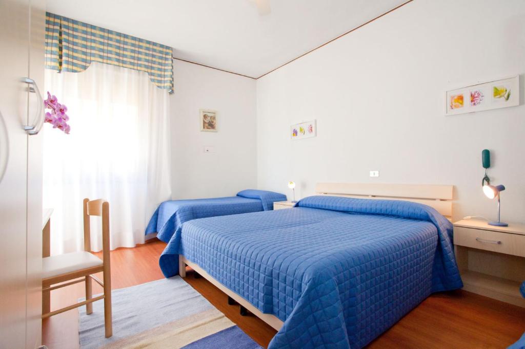 Postel nebo postele na pokoji v ubytování Hotel Telenia