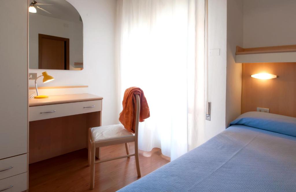 Postel nebo postele na pokoji v ubytování Hotel Telenia