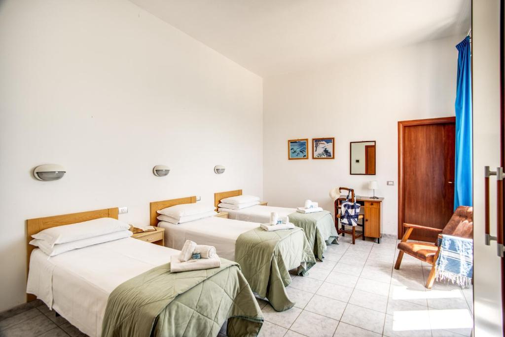 Postel nebo postele na pokoji v ubytování Villa MG Hotel