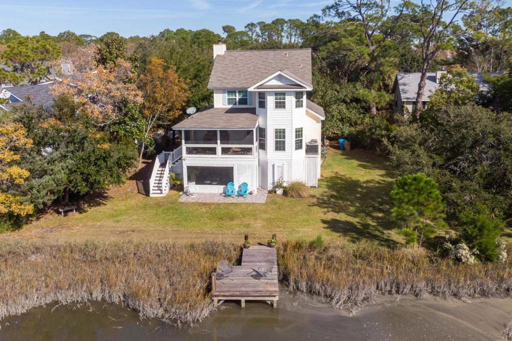 an aerial view of a white house with a dock at Marsh Mellow in Tybee Island