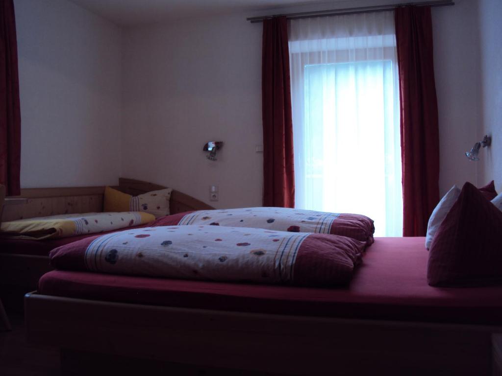 Posteľ alebo postele v izbe v ubytovaní Haus Fliri