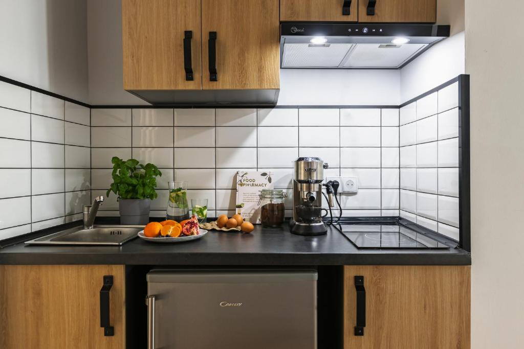 Kuchyňa alebo kuchynka v ubytovaní oompH Warsaw Nowy Swiat Apartment