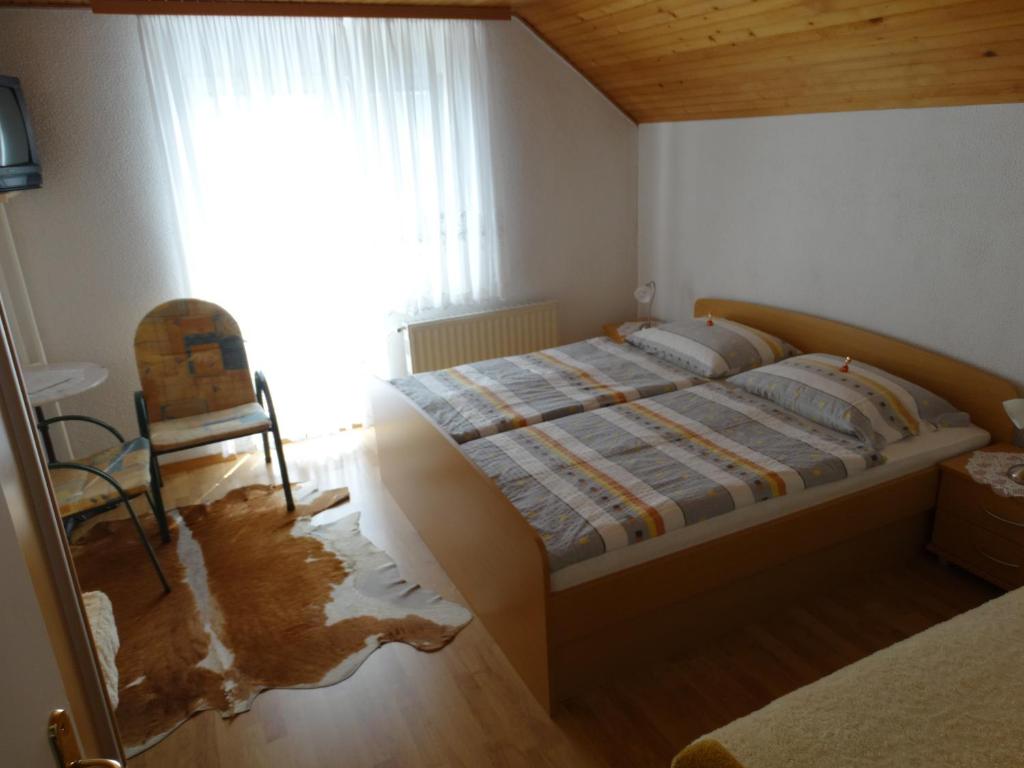 Postel nebo postele na pokoji v ubytování Rooms-Apartment Renata