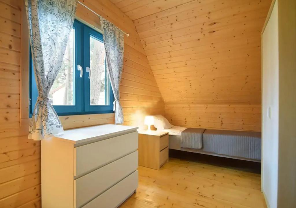 Postel nebo postele na pokoji v ubytování Kolorowe Domki