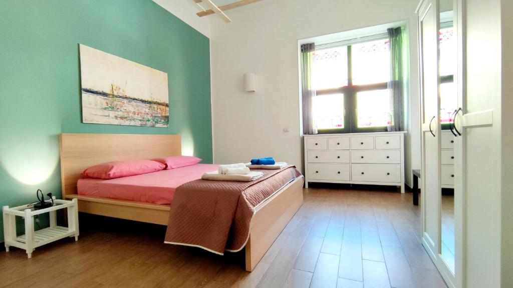 A bed or beds in a room at Casa vacanza San Crispino, Boccetta.