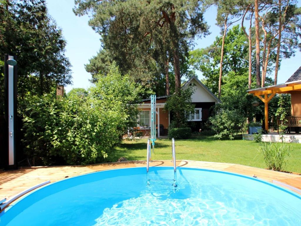 a pool in the backyard of a house at holiday home, Berlin in Berlin