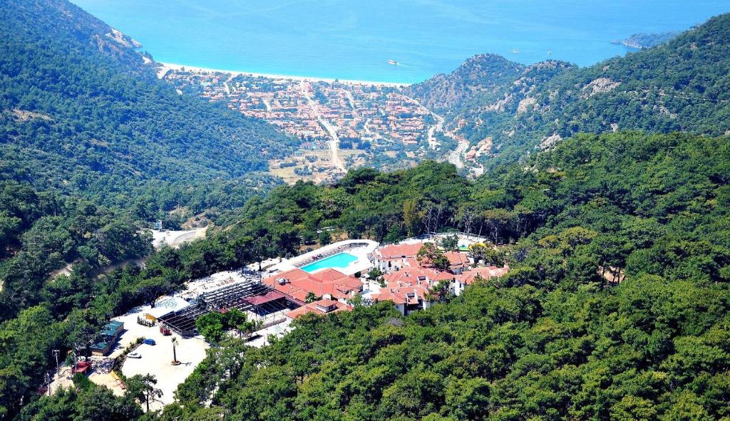 an aerial view of a house on a mountain at Nicholas Park Hotel in Fethiye