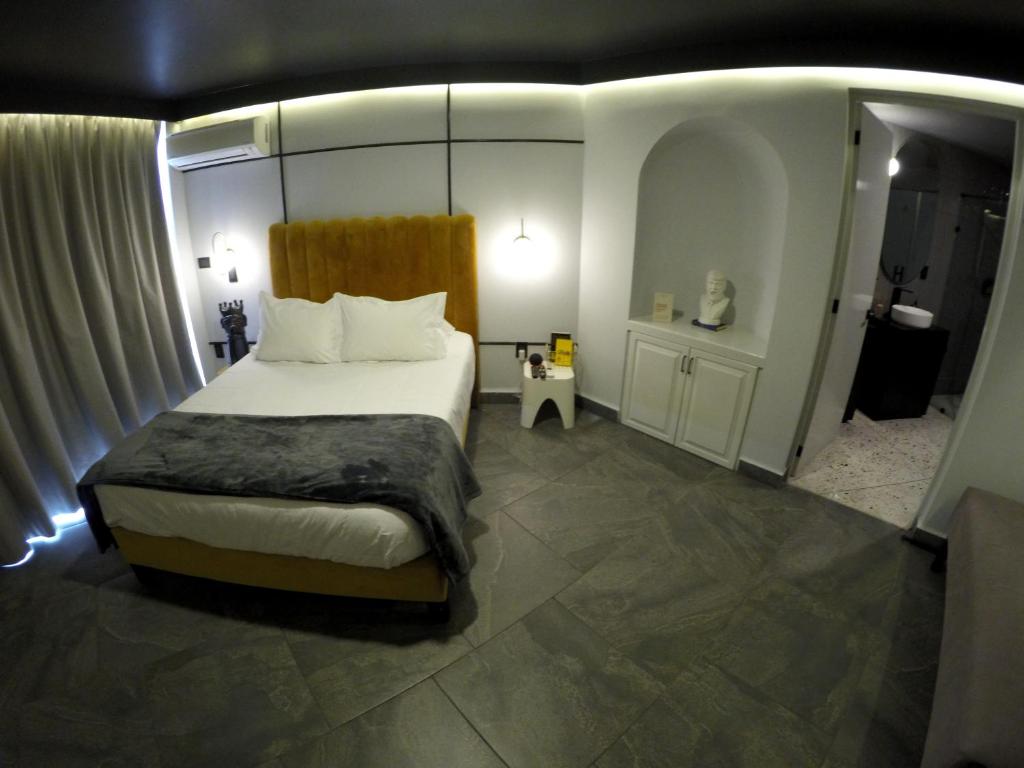 Postel nebo postele na pokoji v ubytování Casa Nada Hotel