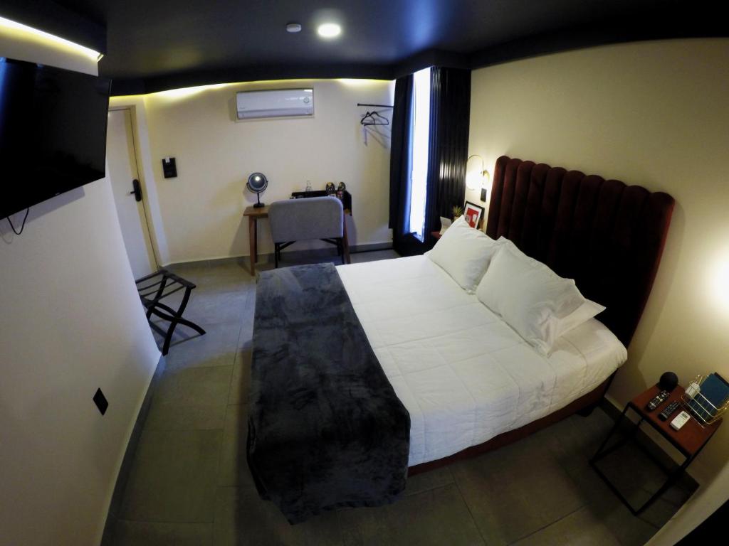 Postel nebo postele na pokoji v ubytování Casa Nada Hotel