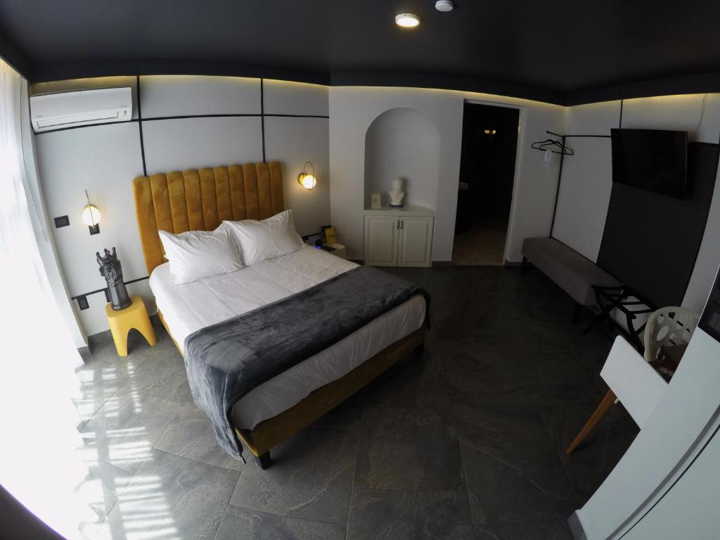 Postel nebo postele na pokoji v ubytování Casa Nada Hotel