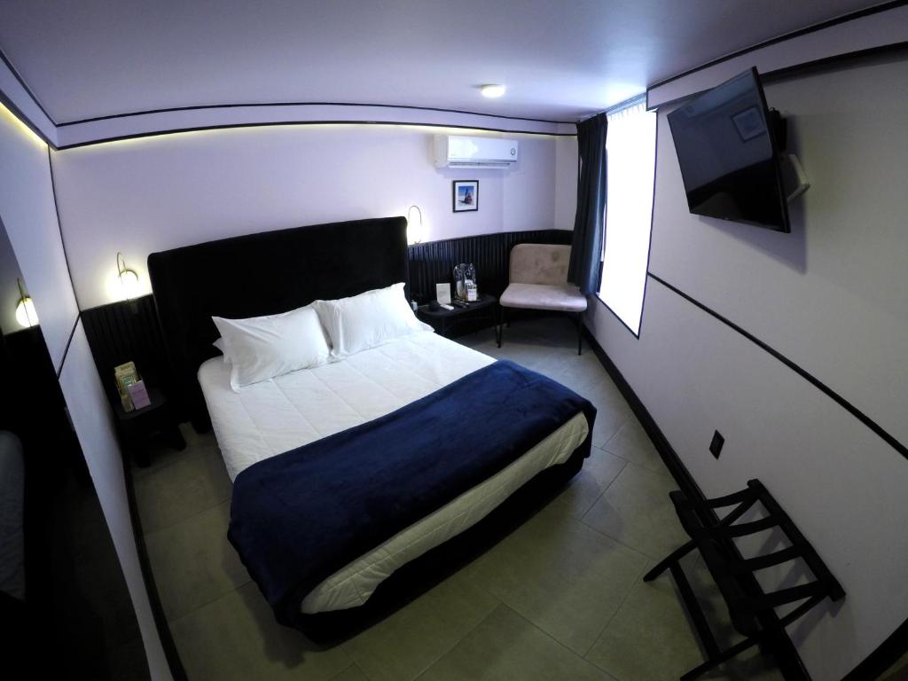 Postel nebo postele na pokoji v ubytování Casa Nada Hotel
