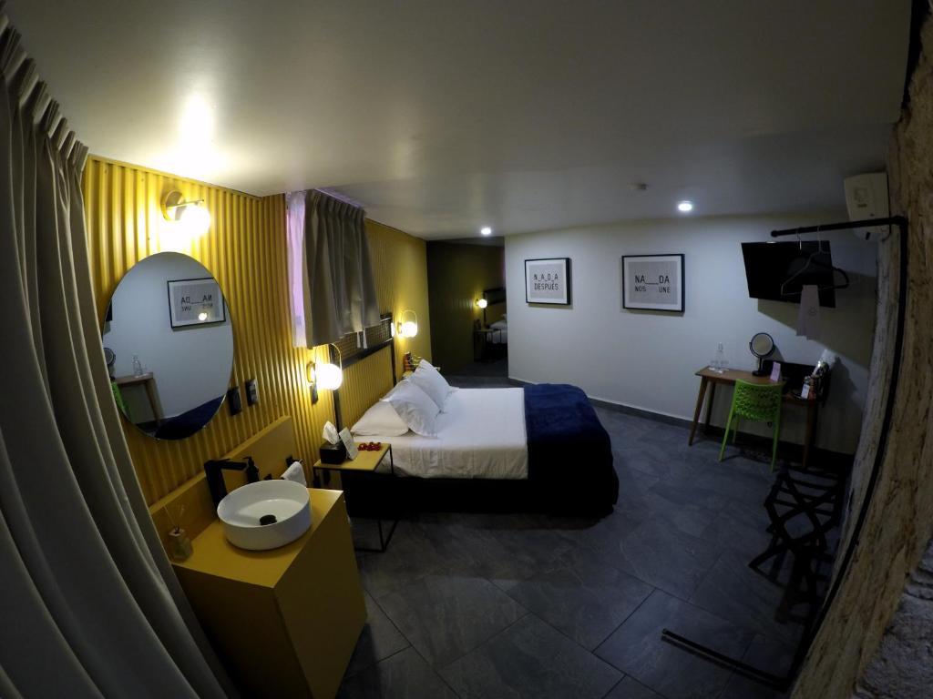 Postel nebo postele na pokoji v ubytování Casa Nada Hotel