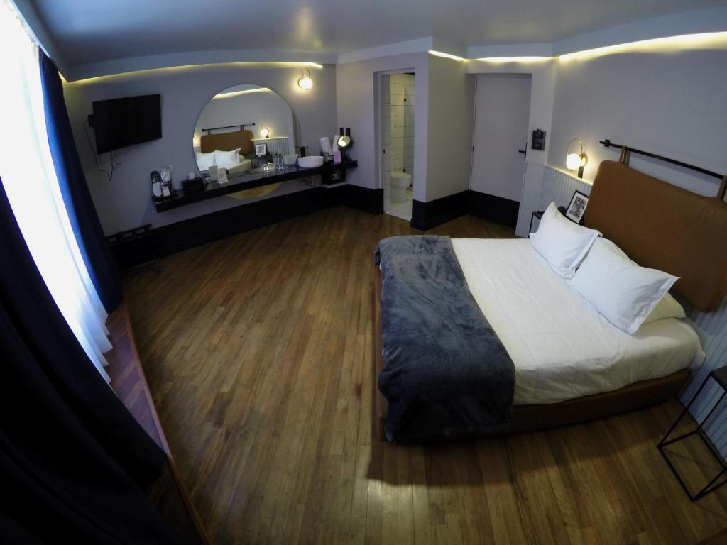 Postel nebo postele na pokoji v ubytování Casa Nada Hotel