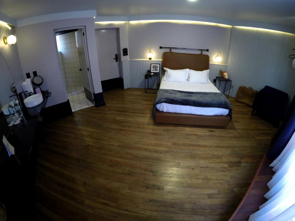 Postel nebo postele na pokoji v ubytování Casa Nada Hotel