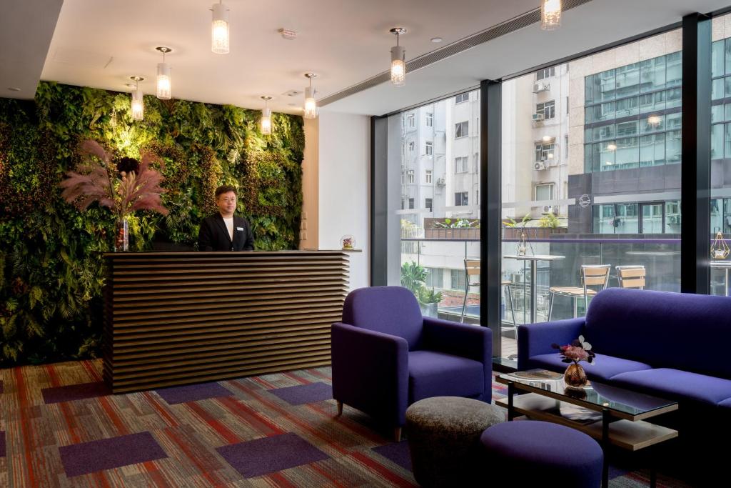 Uma área de estar em Hotel Purple Hong Kong