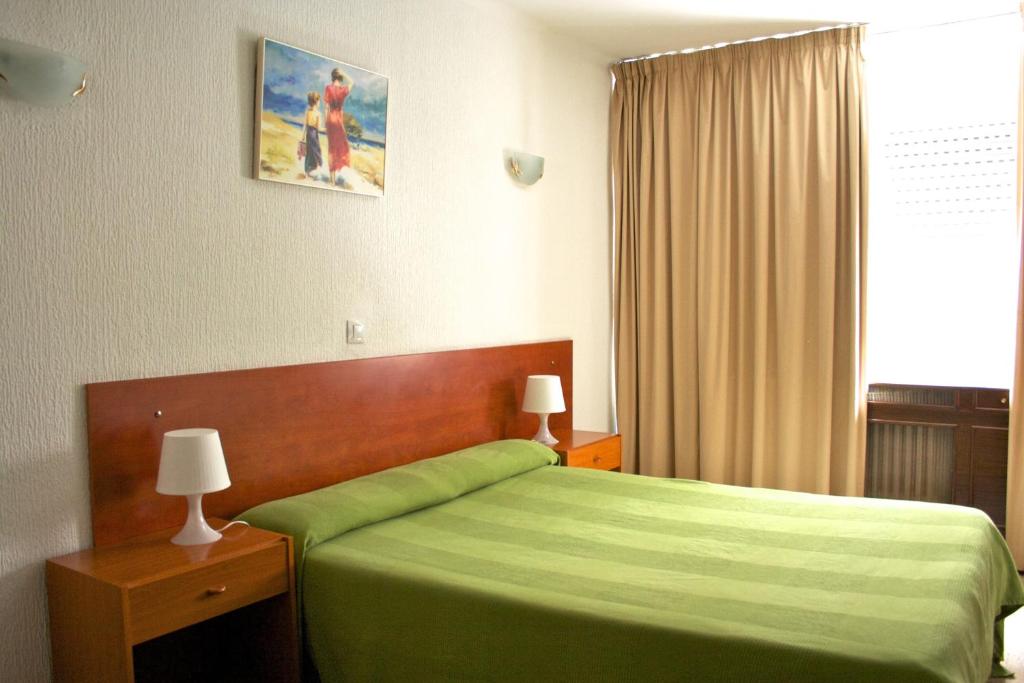 Postel nebo postele na pokoji v ubytování Siracusa