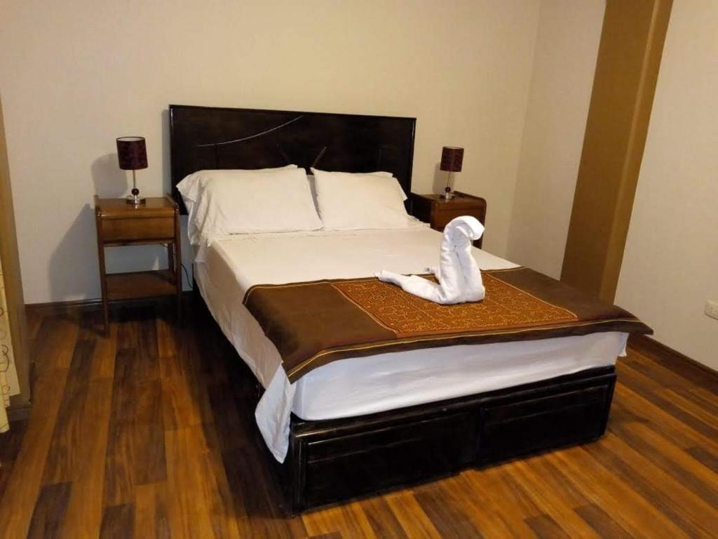 Кровать или кровати в номере Hostal Mirador Korichaska