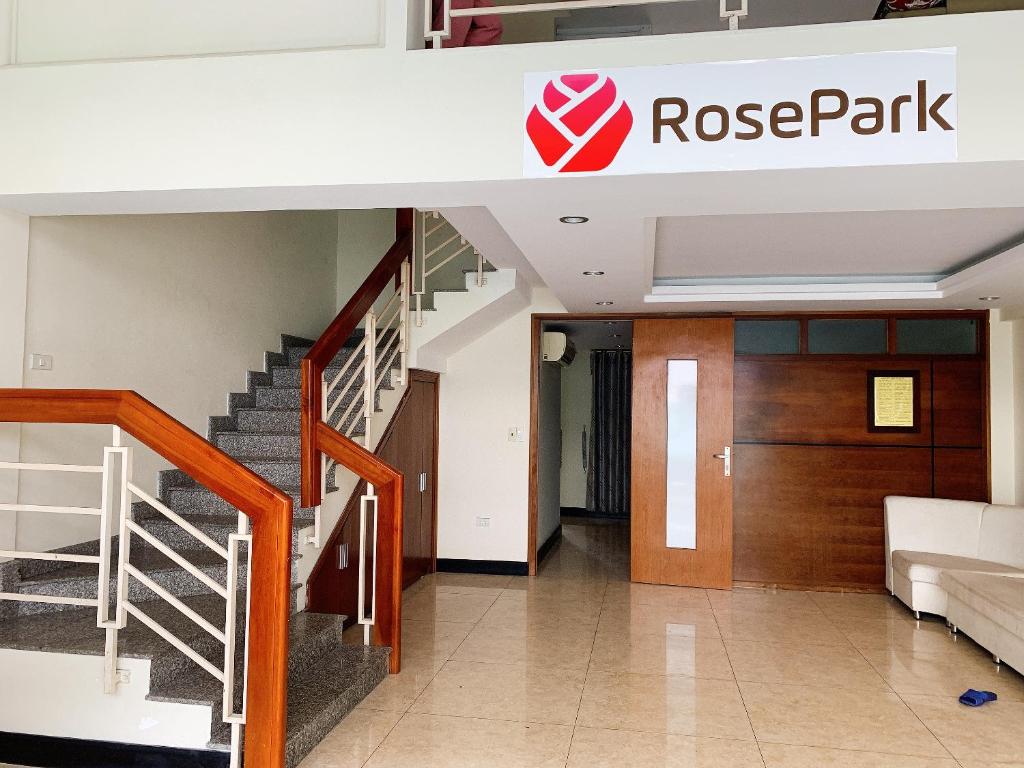 a lobby of a building with a spiral staircase at RosePark Tuan Chau in Ha Long