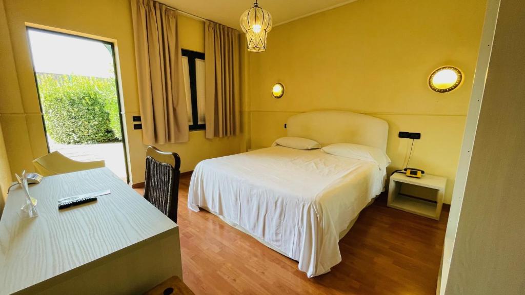 Postel nebo postele na pokoji v ubytování Orzihotel