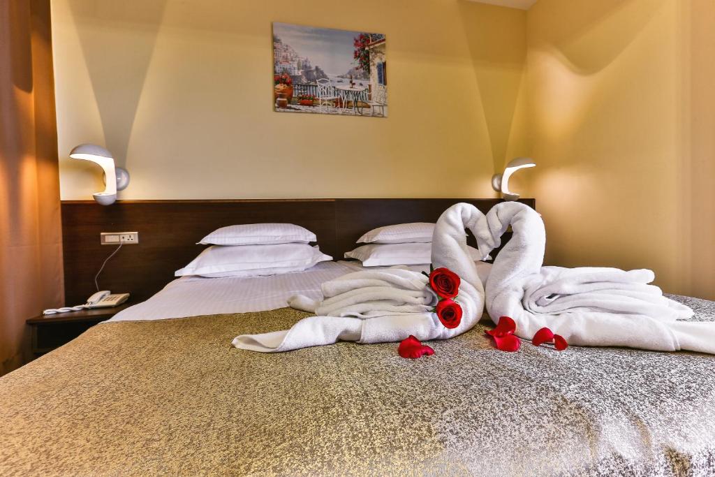 Postel nebo postele na pokoji v ubytování Hotel Premier