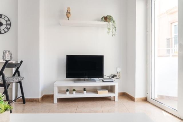 TV a/nebo společenská místnost v ubytování AT TRAJANO 1