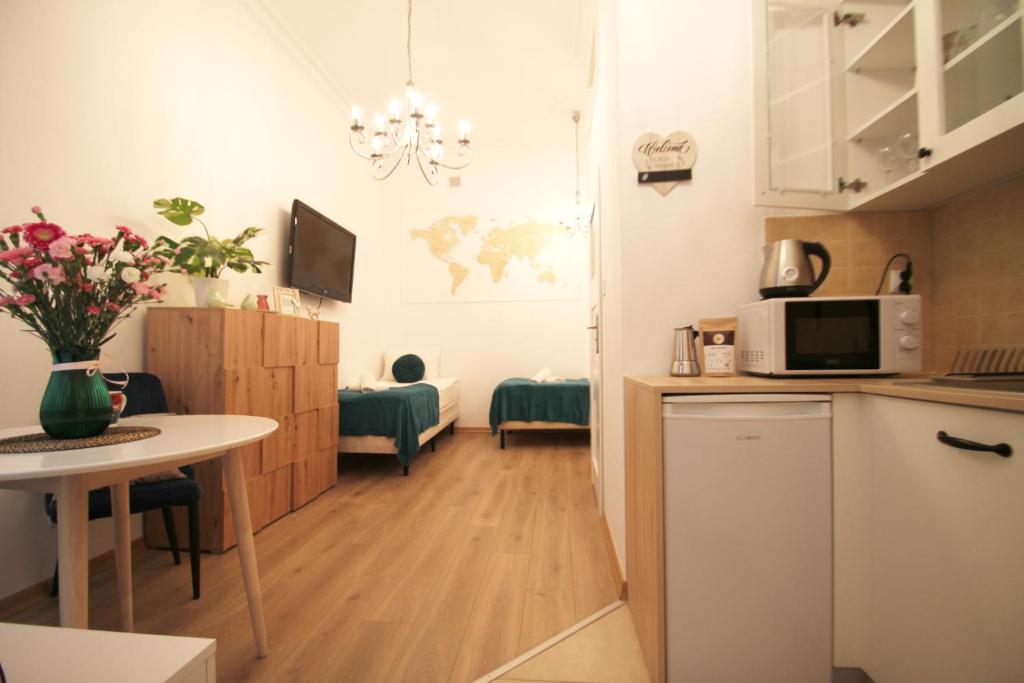 Kuchyňa alebo kuchynka v ubytovaní Cosy & Perfect Located Apartment