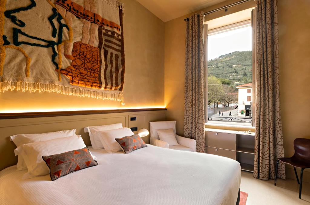 Postel nebo postele na pokoji v ubytování Paradis Pietrasanta