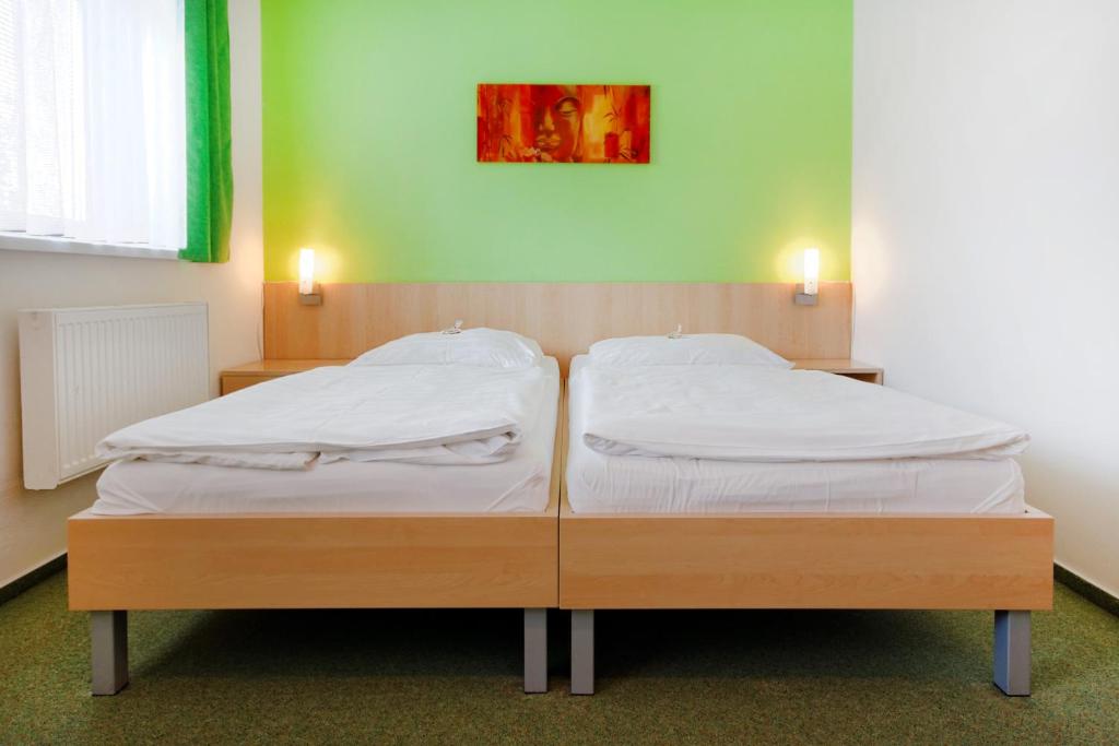 Postel nebo postele na pokoji v ubytování Hotel Senimo