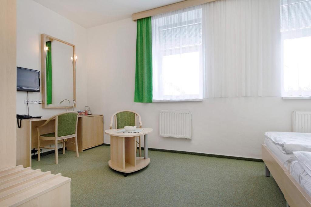 Postel nebo postele na pokoji v ubytování Hotel Senimo