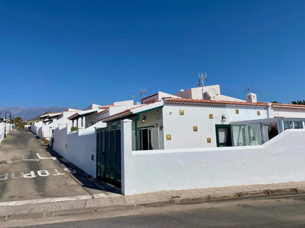 a row of white houses on the side of a street at Atalaya in Abades