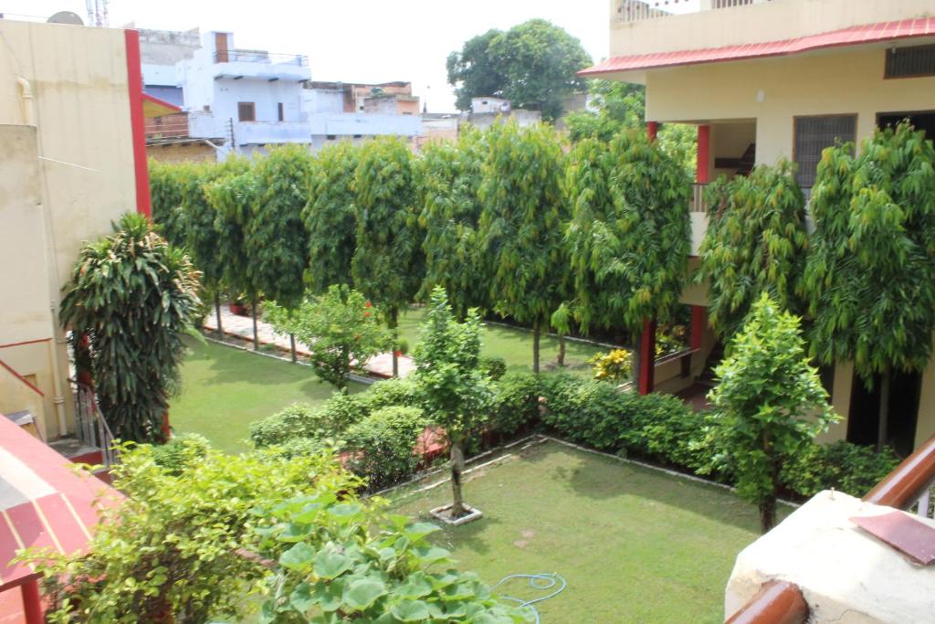 a view of a garden from the balcony of a building at Singh Guest House in Varanasi