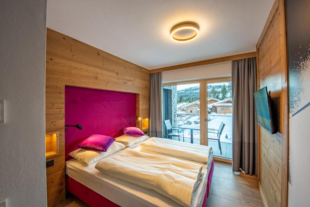 Postel nebo postele na pokoji v ubytování Chalet Königsleiten 148