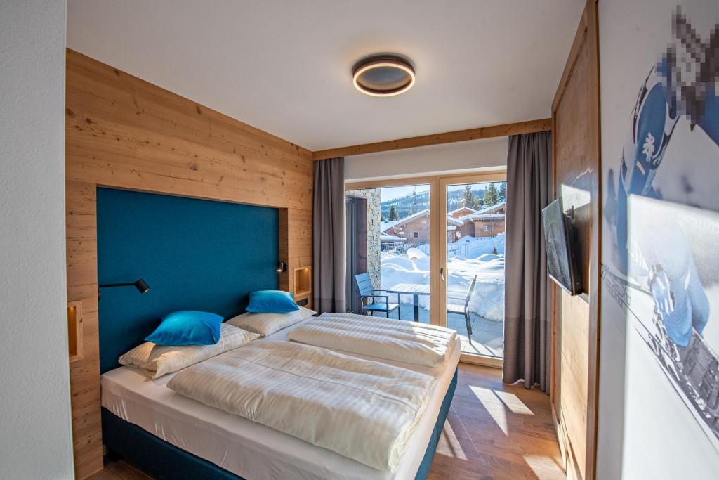Postel nebo postele na pokoji v ubytování Chalet Königsleiten 148
