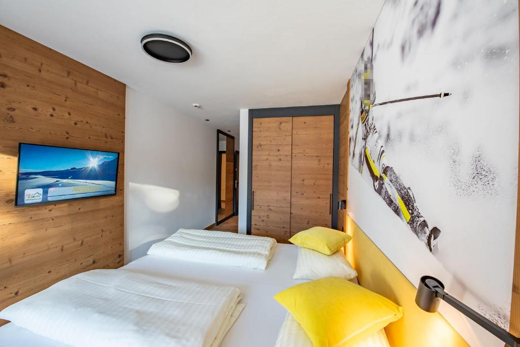 Postel nebo postele na pokoji v ubytování Chalet Königsleiten 148