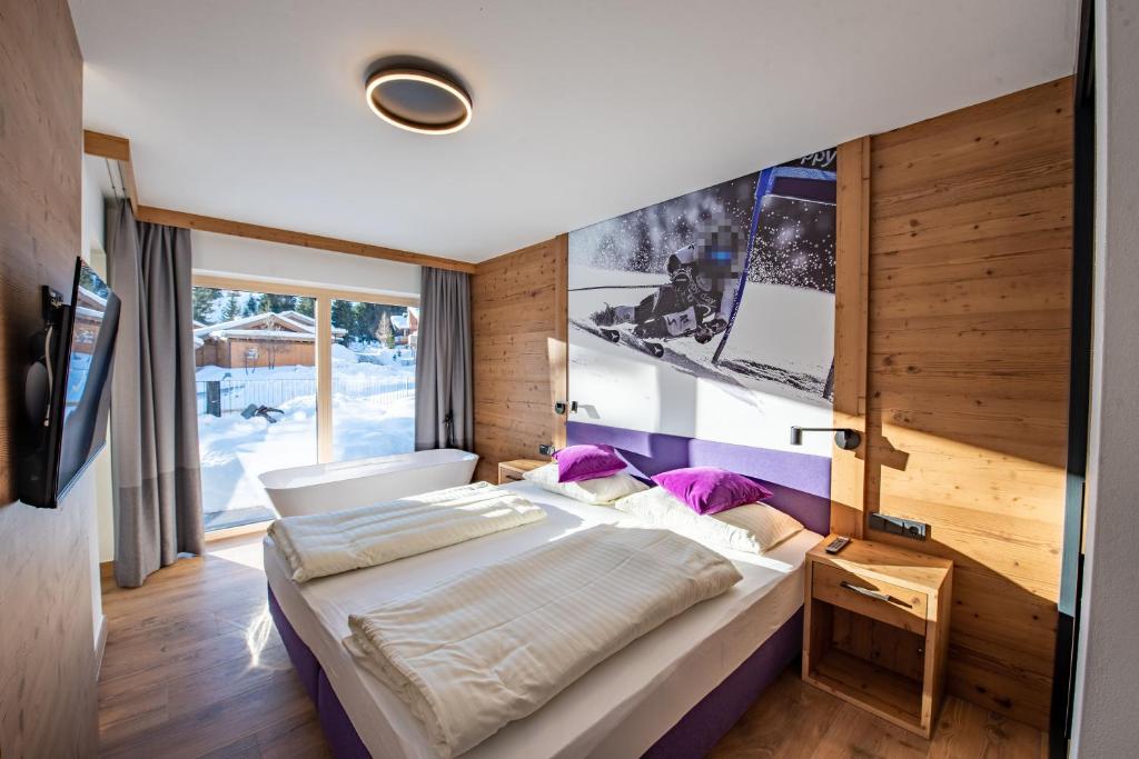 Postel nebo postele na pokoji v ubytování Chalet Königsleiten 148
