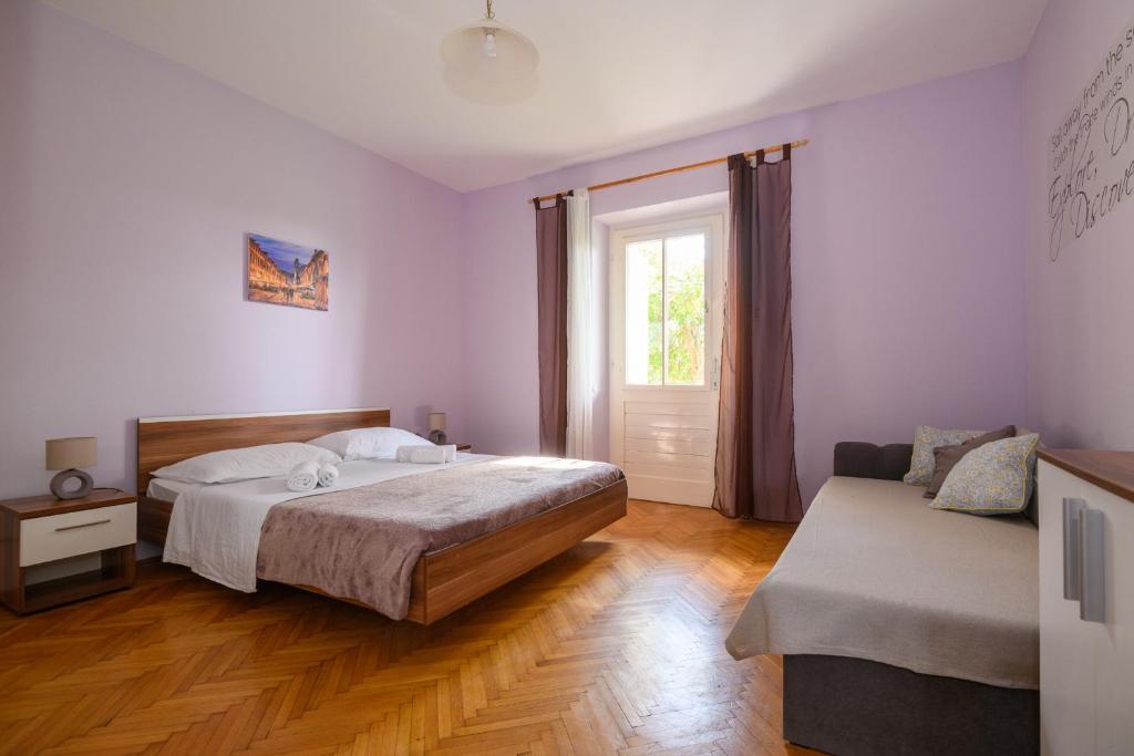 Postel nebo postele na pokoji v ubytování Apartment Rosehip