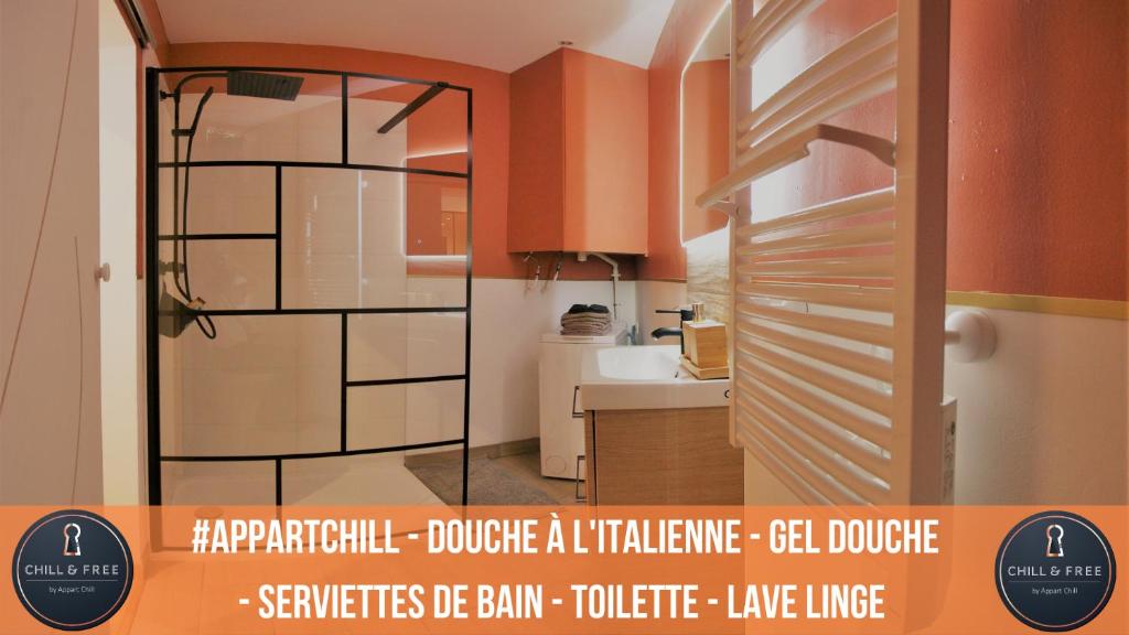 a bathroom with a glass door in a kitchen at Appart Chill & Free - Proche Centre Valenciennes - Parking Gratuit in Valenciennes